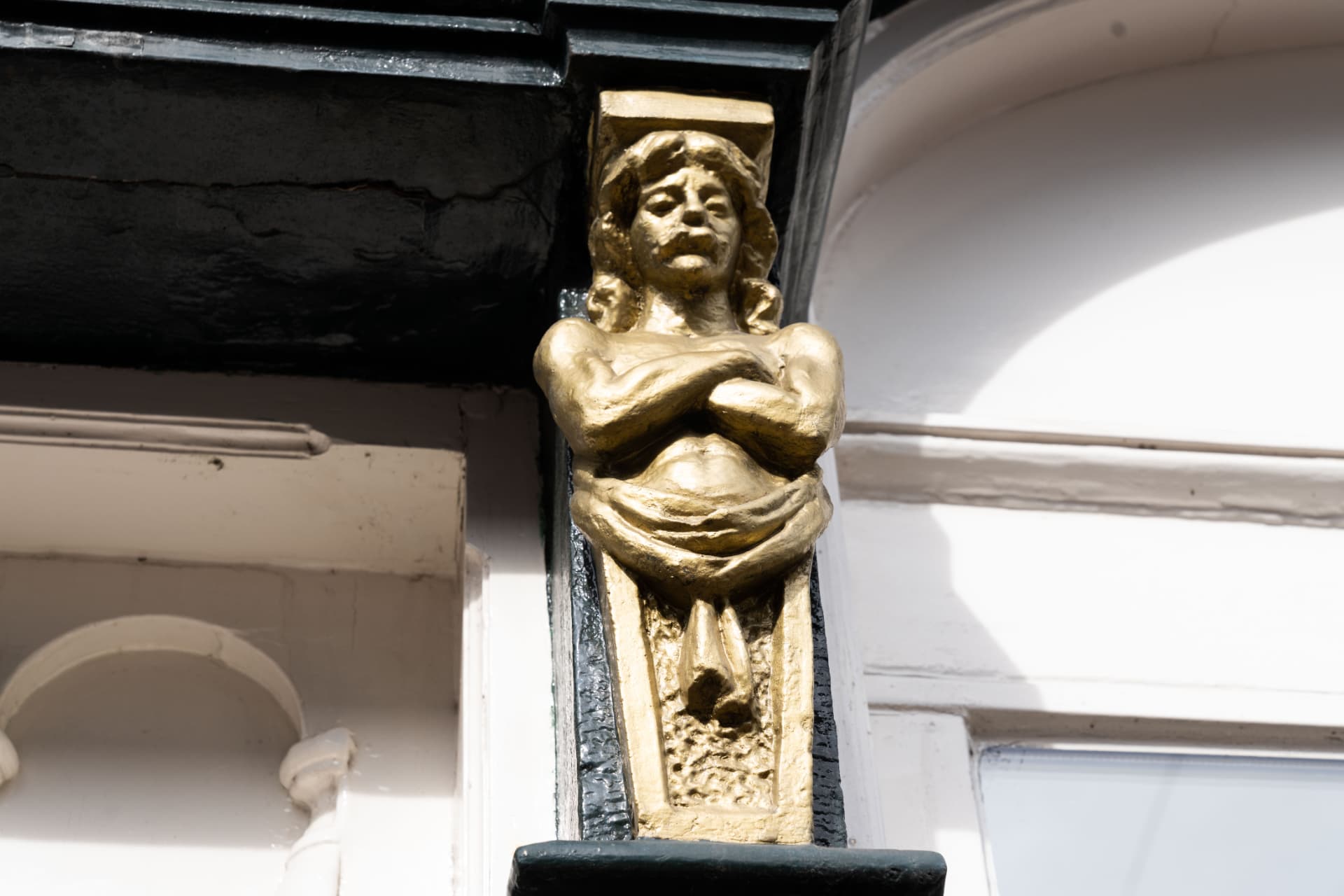 Gouden gevelbeeld aan de Rozengracht